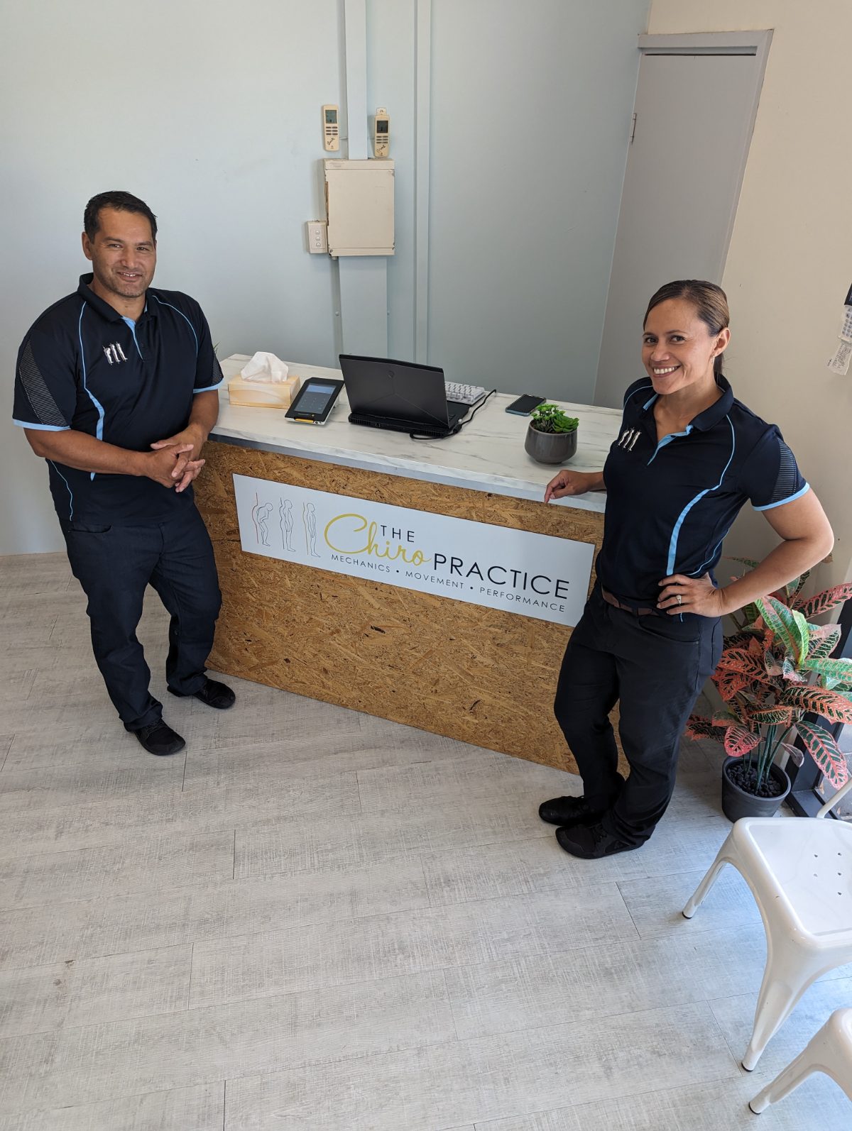 Dr Corey Joyce and Geraldine at the front desk of The Chiropractice